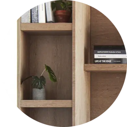 Close up of home office furnishing details featuring a shelf with books and plant at Hendrix House, Gramercy condos.